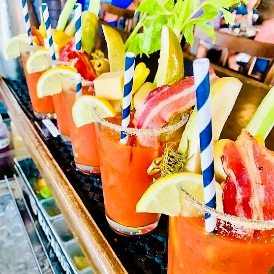 Bloody Mary Lineup Cropped A row of bloody mary drinks lined up on the bar